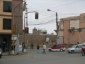 Heading toward a busy street, more earthquake damage