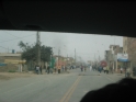 Smoke in the distance from the burning bus during the protest