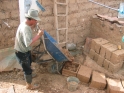 Pouring the mud to make adobe bricks